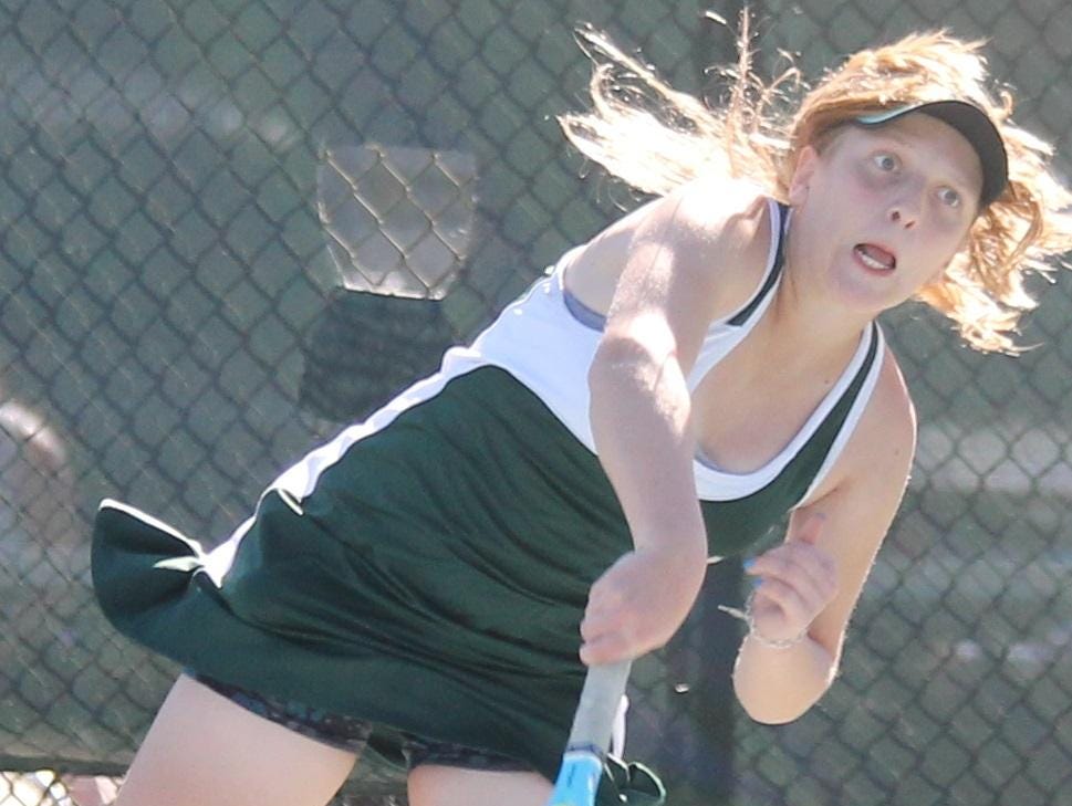 McNicholas freshman Kay Daly serves during her match against Harrison Sept. 14.