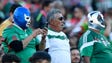 Three fans show their support for the Mexico team in