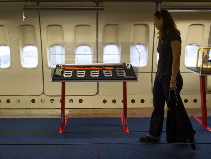 A visitor looks at an exhibit located in the rear of