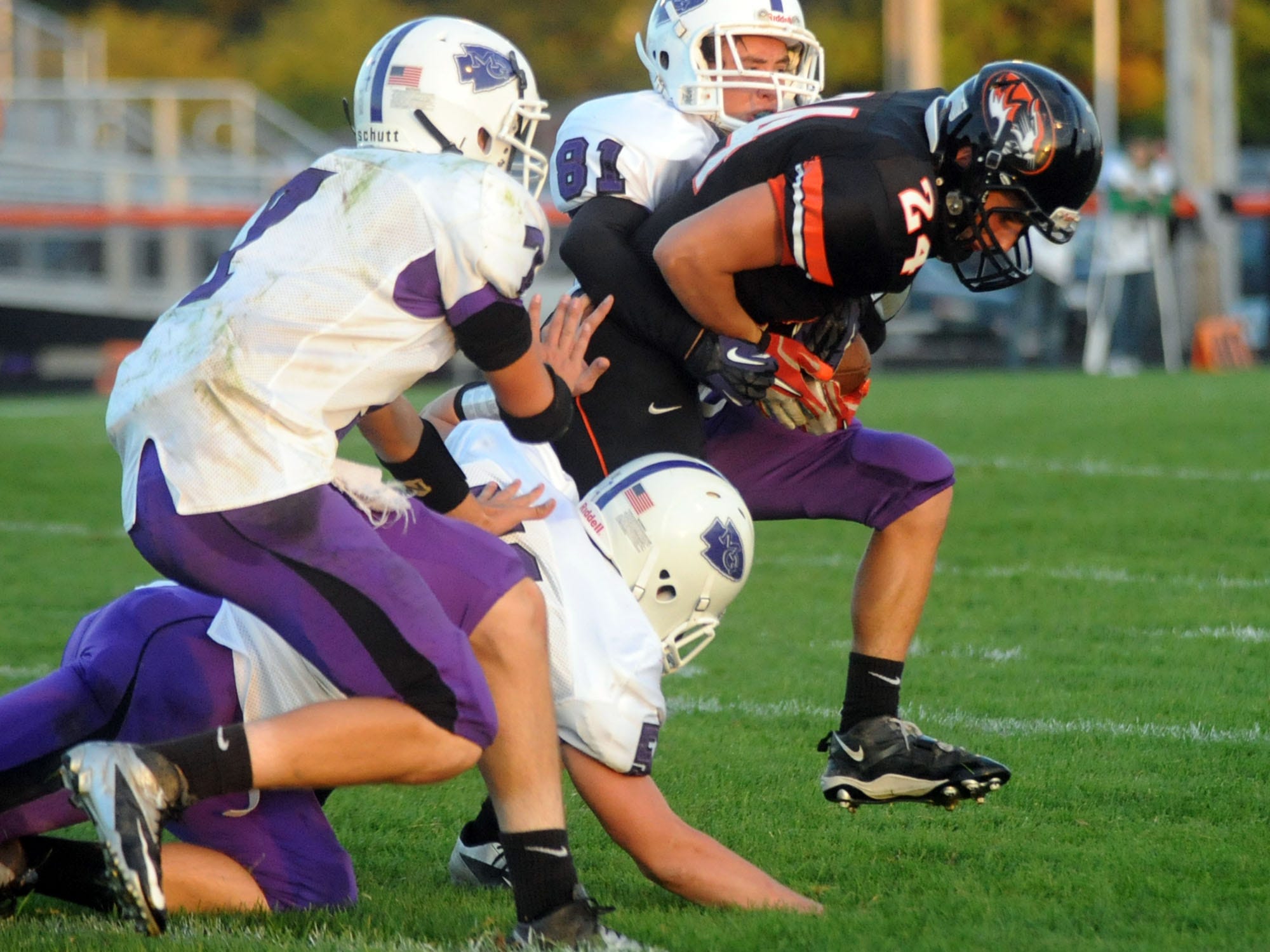 Mount Gilead’s Joseph Elson (81) and his teammates wrap up North Union’s Daniel Barr during last year’s game at North Union High School.