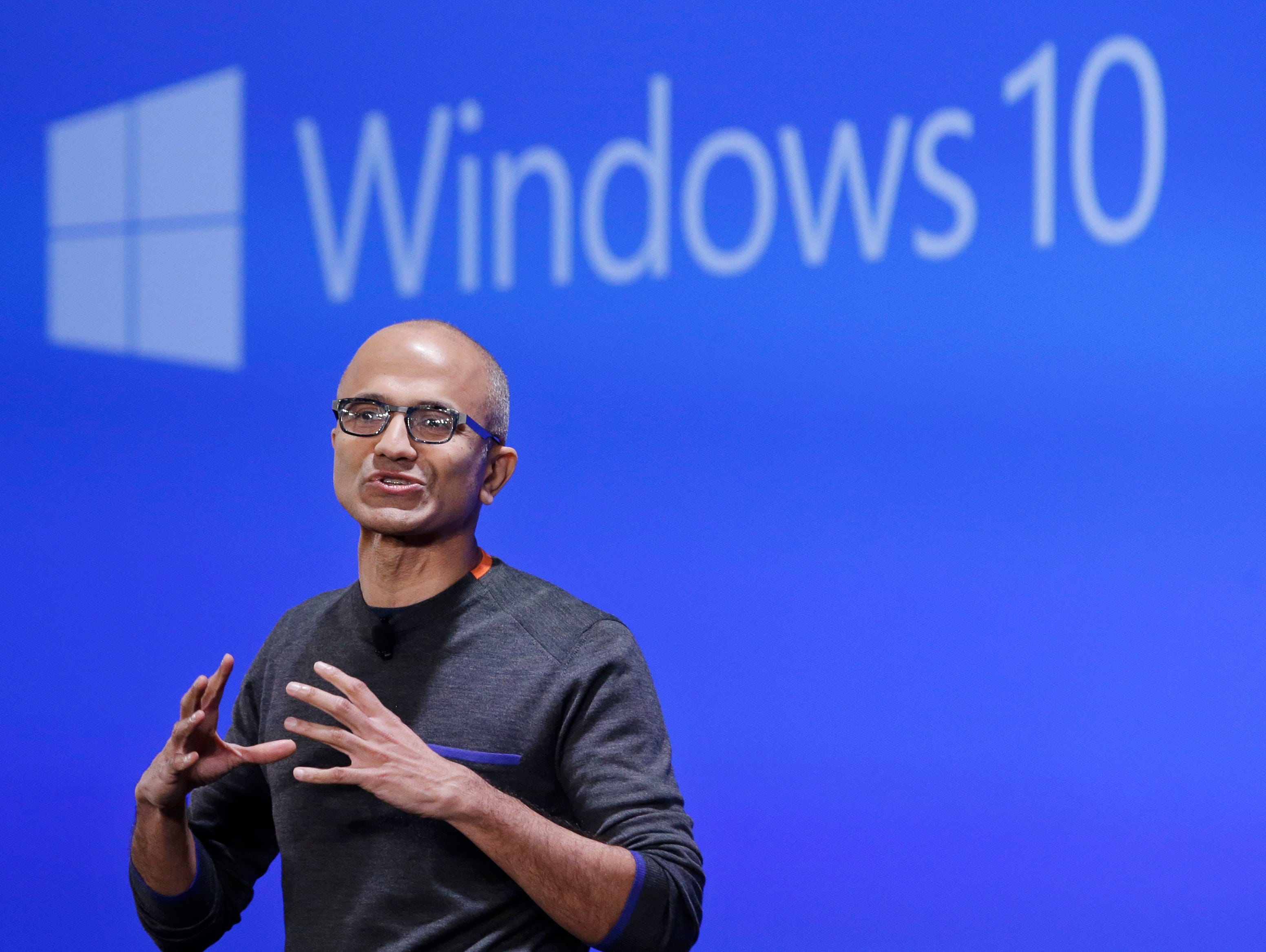 FILE - In this Jan. 21, 2015 file photo, Microsoft CEO Satya Nadella speaks at an event demonstrating the new features of Windows 10 at the company's headquarters in Redmond, Wash. Microsoft reports quarterly financial results on Monday, Jan. 26, 201