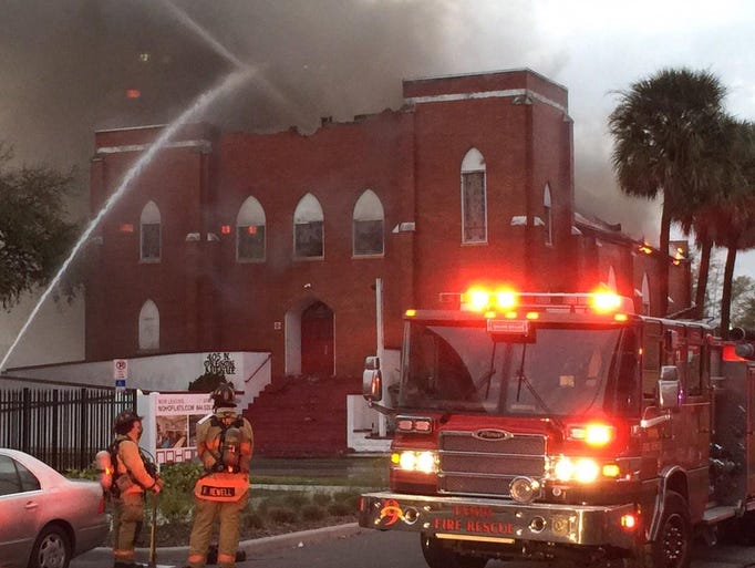 Heavy smoke fills the air as a Tampa church burns on