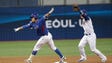 March 9: Korea's Park Suk-min, left, is tagged out