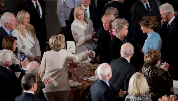 President Trump shakes hands with Hillary Clinton as