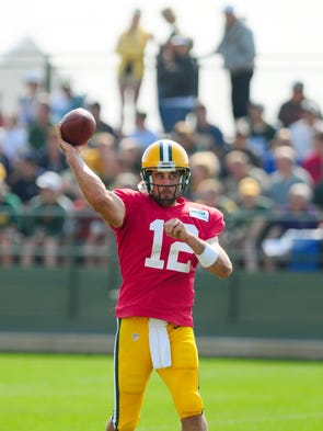 Green Bay Packers quarterback Aaron Rodgers throws during training camp practice at Ray Nitschke Field, Thursday, July 31, 2014.