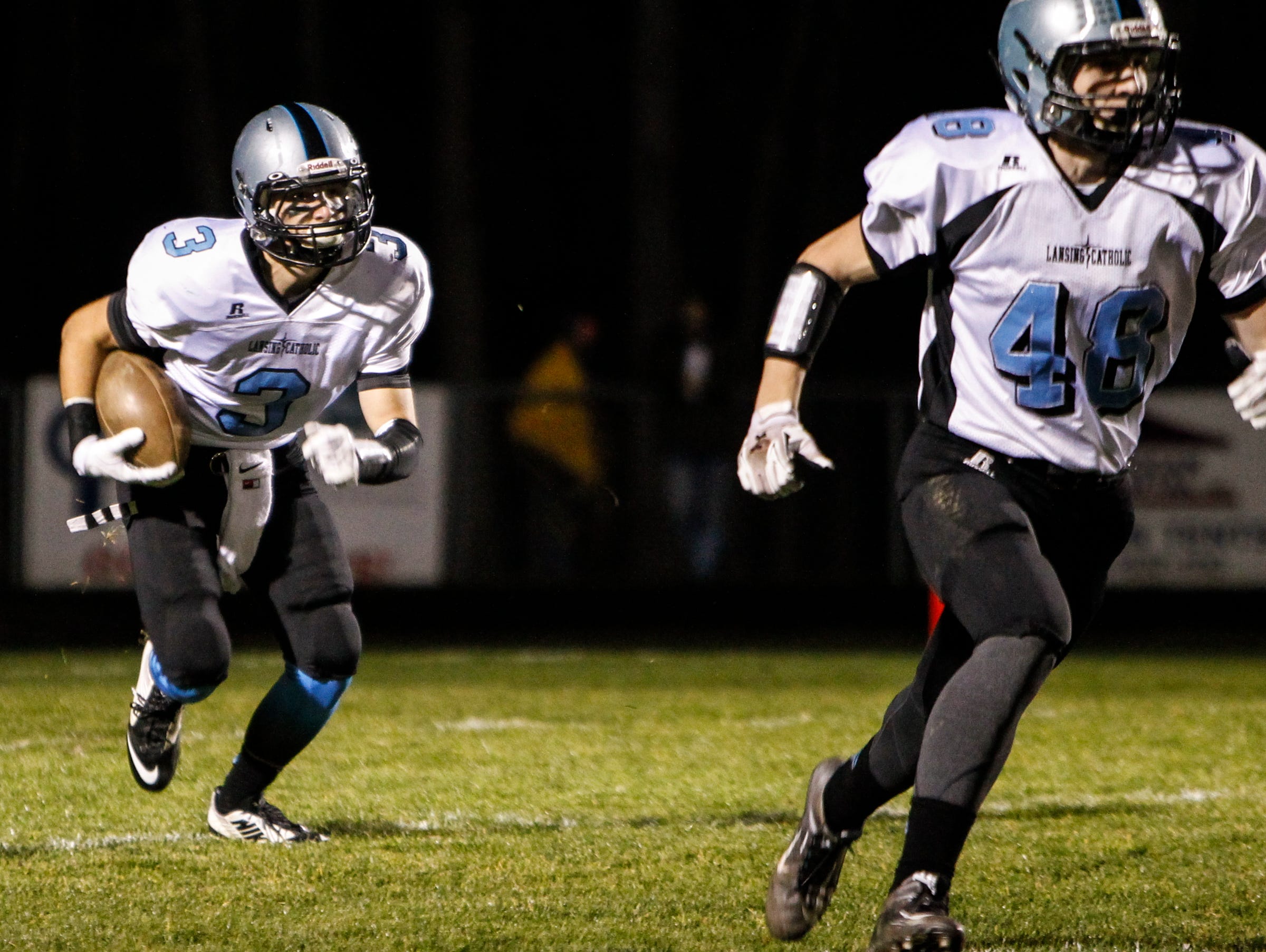 Ryan Ruiter (3) and Eli Whitney, right, will try to help Lansing Catholic reach the playoffs for an eighth straight year this fall. The Cougars have won a combined 24 games the last two seasons.