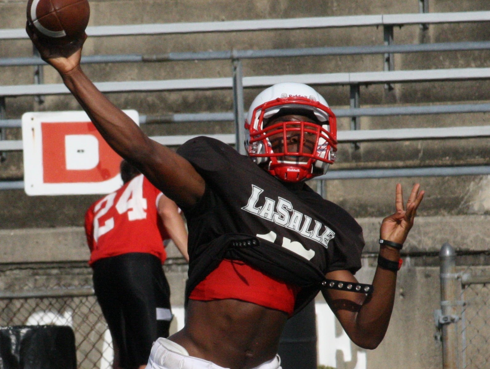 La Salle High School junior quarterback Nick Watson fires a pass during practice Aug. 19 at La Salle. Watson threw for 1,864 yards and 22 touchdowns last year as a sophomore. He’s currently is competition with senior Eric Greene for the starting job in 2014.