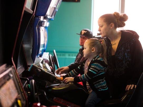 Jessica Mundorf, of Dover, watches her step-daughter