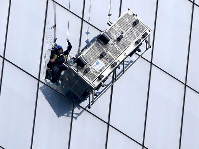 WINDOW CLEANERS RESCUED FROM SCAFFOLDS ON 69TH FLOOR OF THE WTC