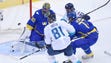 Team Sweden goalie Henrik Lundqvist (30) makes a save