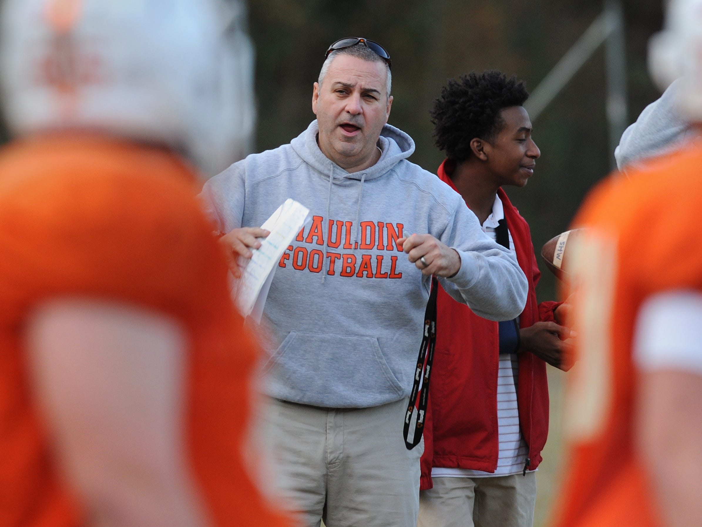 Mauldin head coach Lee Taylor calls plays to the offense during the teams practice Monday, November 16, 2015. Mauldin will play Hillcrest in the 1st round of the AAAA playoffs Friday at Hillcrest.