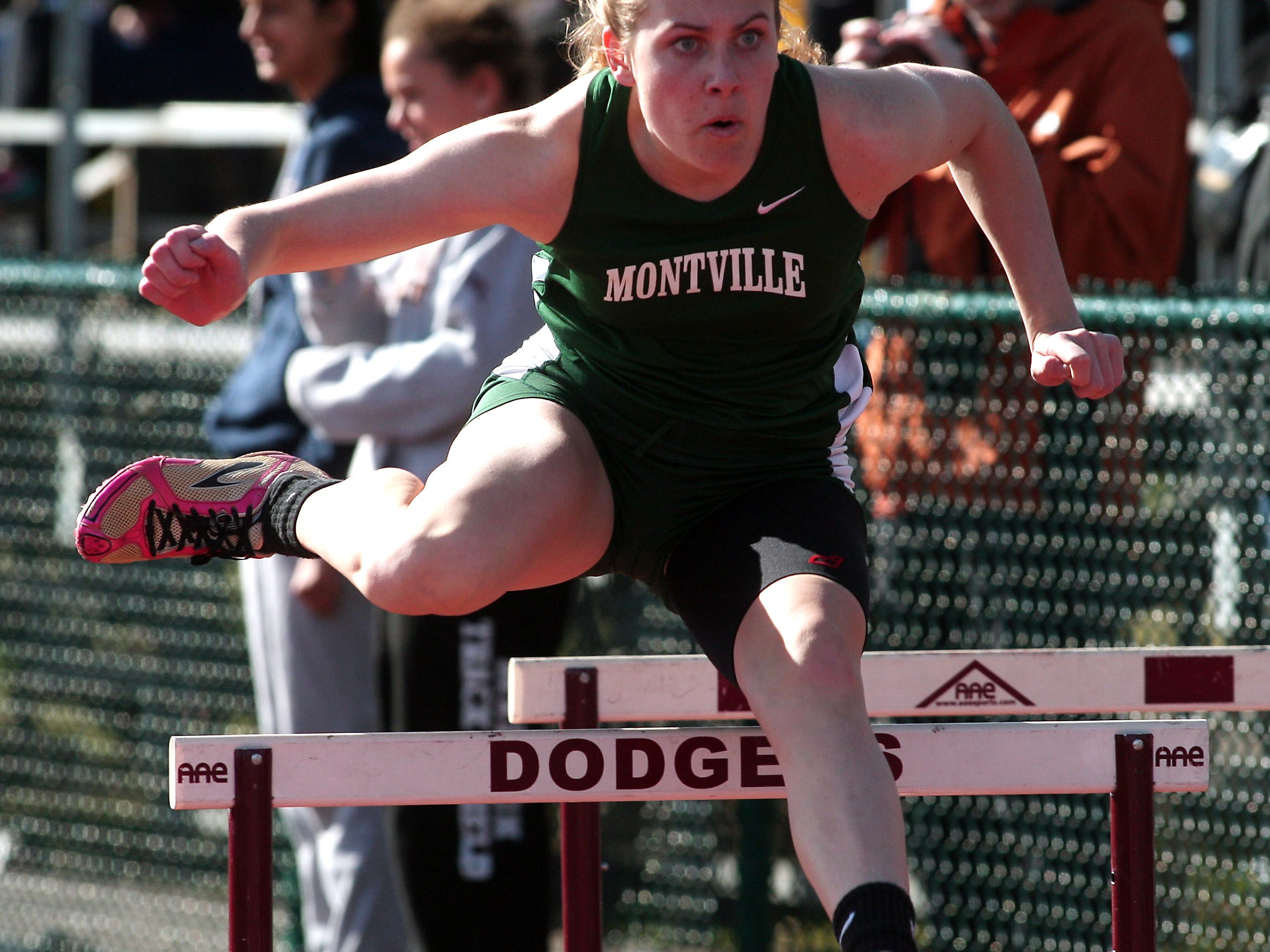 Montville junior Leah Wis clears a hurdle during the Don Growley shuttle hurdles at Dodgertown Relays.