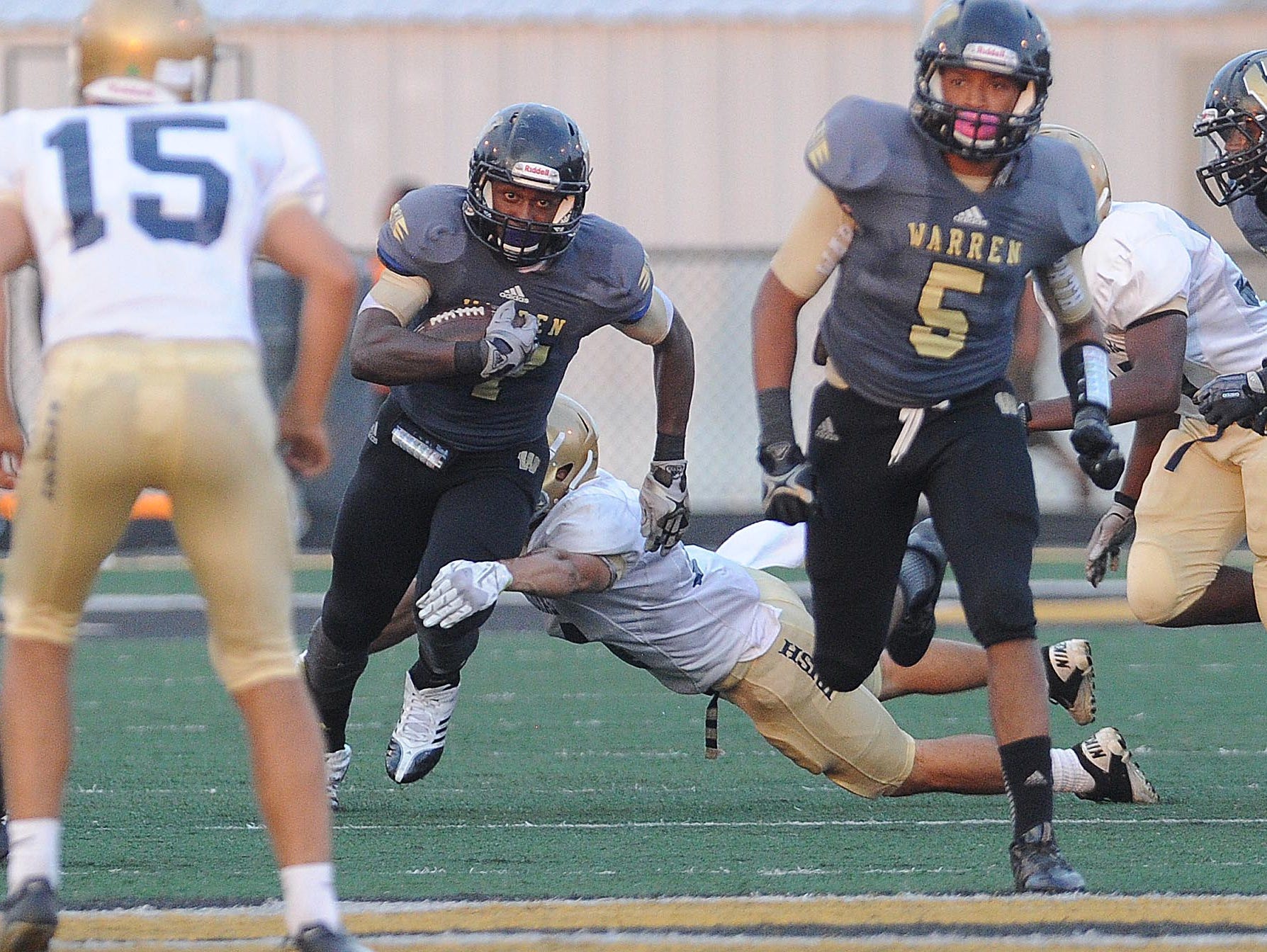 FILE – Darius Lee of Warren Central returns a kickoff against Cathedral, Aug. 30, 2013.