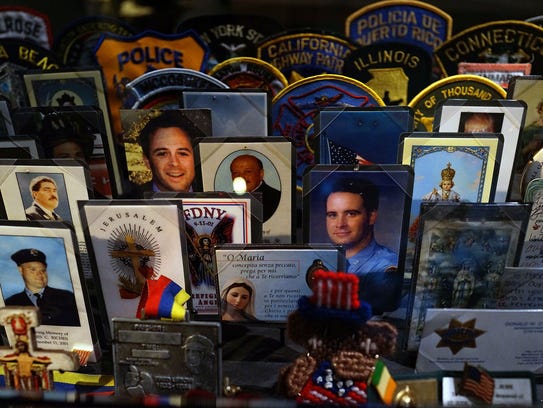 Cards, patches and mementos of those killed at the
