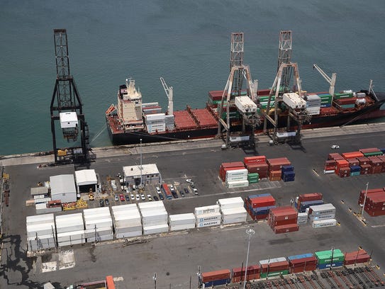 A container ship is seen docked at the port of San