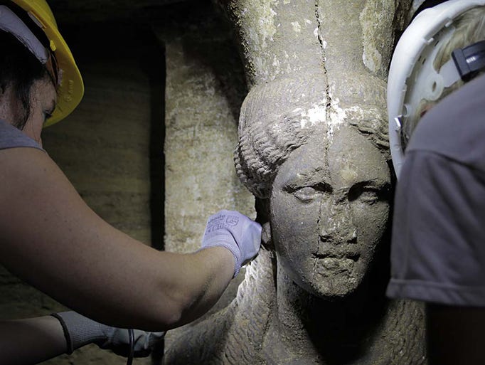 One of two female figures serving as supports, or caryatids, stands inside the Kasta Tumulus tomb on Sept. 7 in Amphipolis, northern Greece. The 7 foot-tall stone maidens guard a mysterious tomb that dates to the age of Alexander the Great.