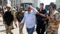 Egyptian security forces help an injured man after he left the al-Fateh mosque at Cairo's Ramses Square. Egyptian security forces entered a mosque in Cairo after an exchange of gunfire with barricaded backers of toppled Islamist president Mohammed Morsi.
