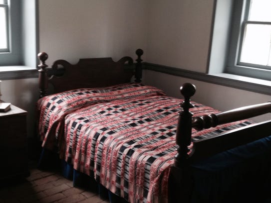 A bed is on display in the extensive finished basement