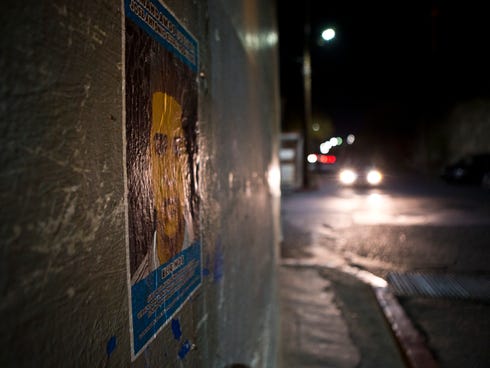 A poster on the emergency medical office building is seen in Nogales, Sonora, depicts 16-year-old Jose Antonio Elena Rodriguez, who died after being shot multiple times by one or more U.S. Border Patrol agents.