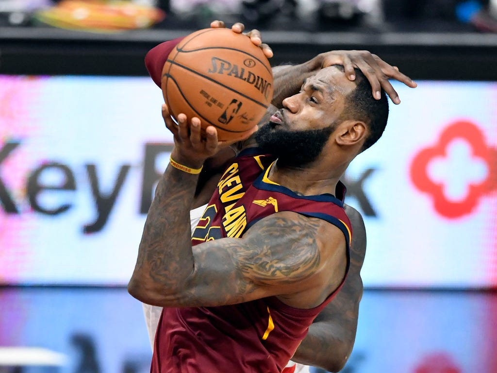 Cleveland Cavaliers forward LeBron James  is hit in the head by Atlanta Hawks forward Taurean Prince while driving to the basket in the fourth quarter at Quicken Loans Arena in Cleveland.