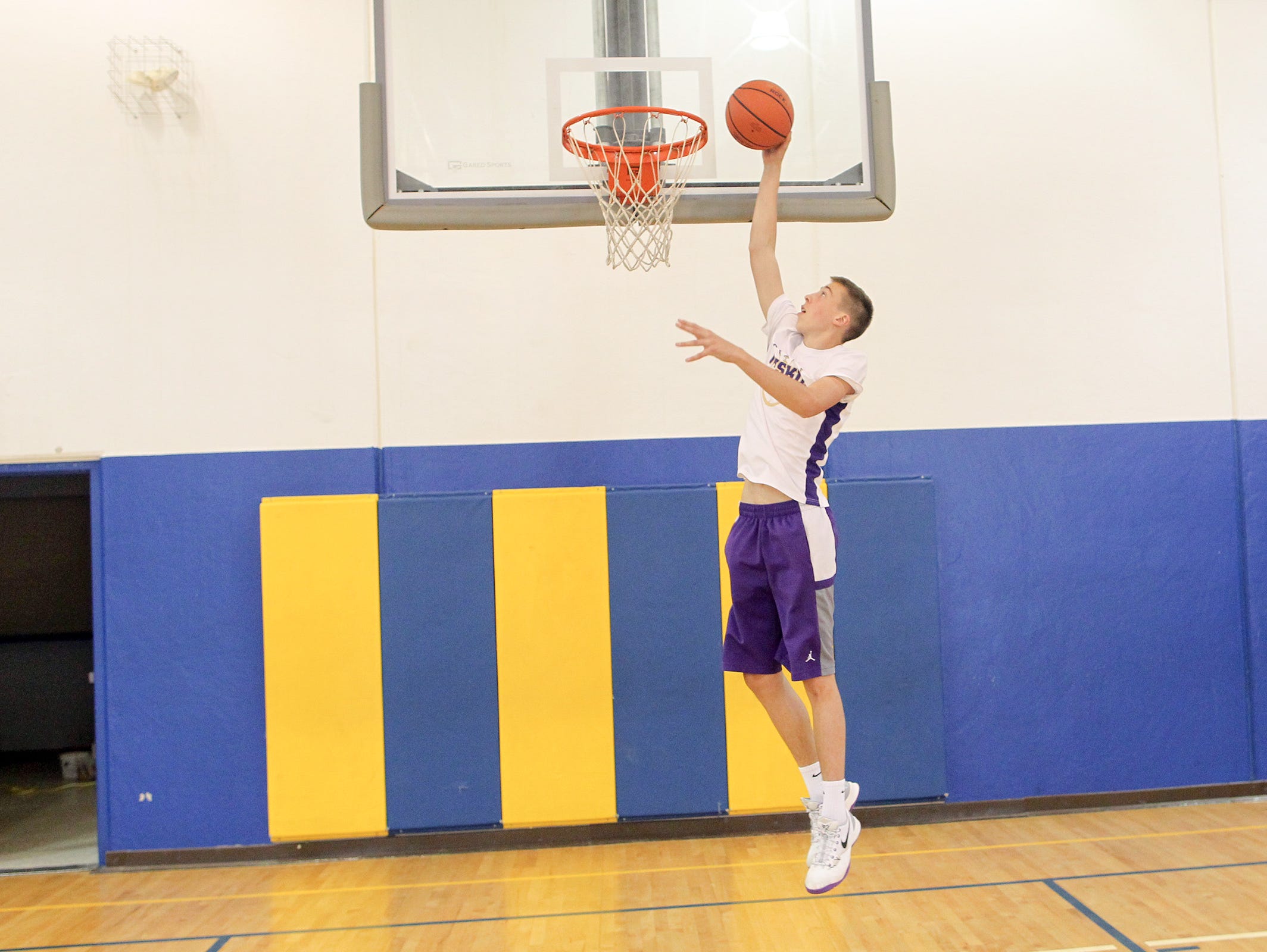 Muscatine's Joe Wieskamp goes up for a dunk at the West Middle School gym in Muscatine on Thursday, July 2, 2015.