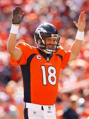 Denver Broncos quarterback Peyton Manning (18) during