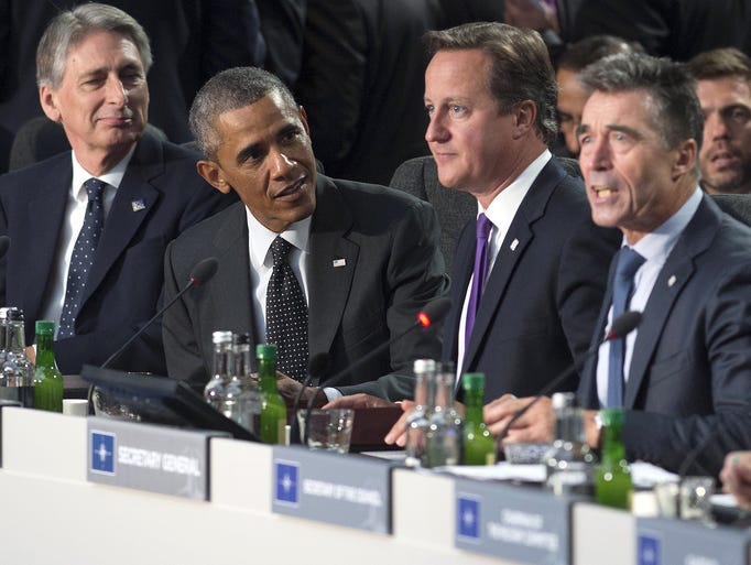 British Foreign Secretary Philip Hammond, left, President Obama, British Prime Minister David Cameron and NATO Secretary-General Anders Fogh Rasmussen attend a meeting on Afghanistan  on the first day of the NATO 2014 summit on Sept. 4 at the Celtic Manor Resort in Newport, Wales.