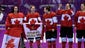 Canada players celebrate during the flower ceremony after defeating USA in the gold medal game.