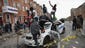 BALTIMORE, MD - APRIL 27:  Demonstrators climb on a