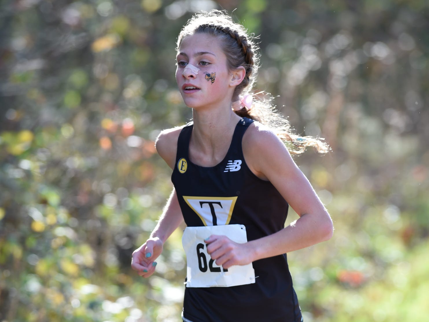 Tatnall's Keelin Hays leads the girl's division II DIAA Cross Country State Championships at Killens Pond State Park in Felton.
