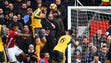 Arsenal's Olivier Giroud scores a header against Manchester