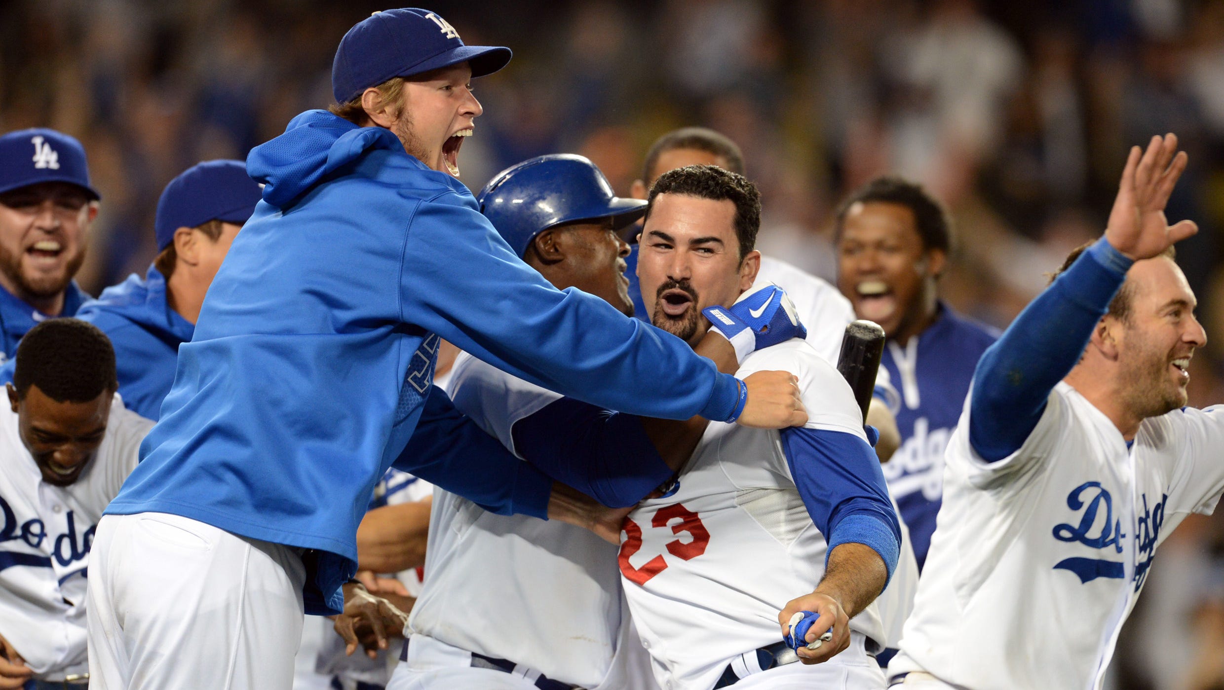 Aug. 9: Los Angeles Dodgers celebrate after first baseman Adrian Gonzalez crossed the plate in the ninth inning of the game for the winning run against the Tampa Bay Rays.