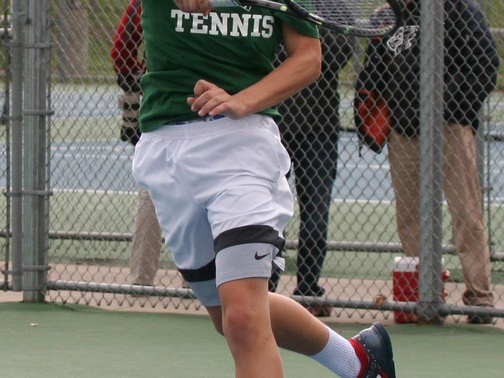 Oliver Weaver slams a forehand in the Division 4 State Tennis Championships on his way to the singles title Oct. 15.