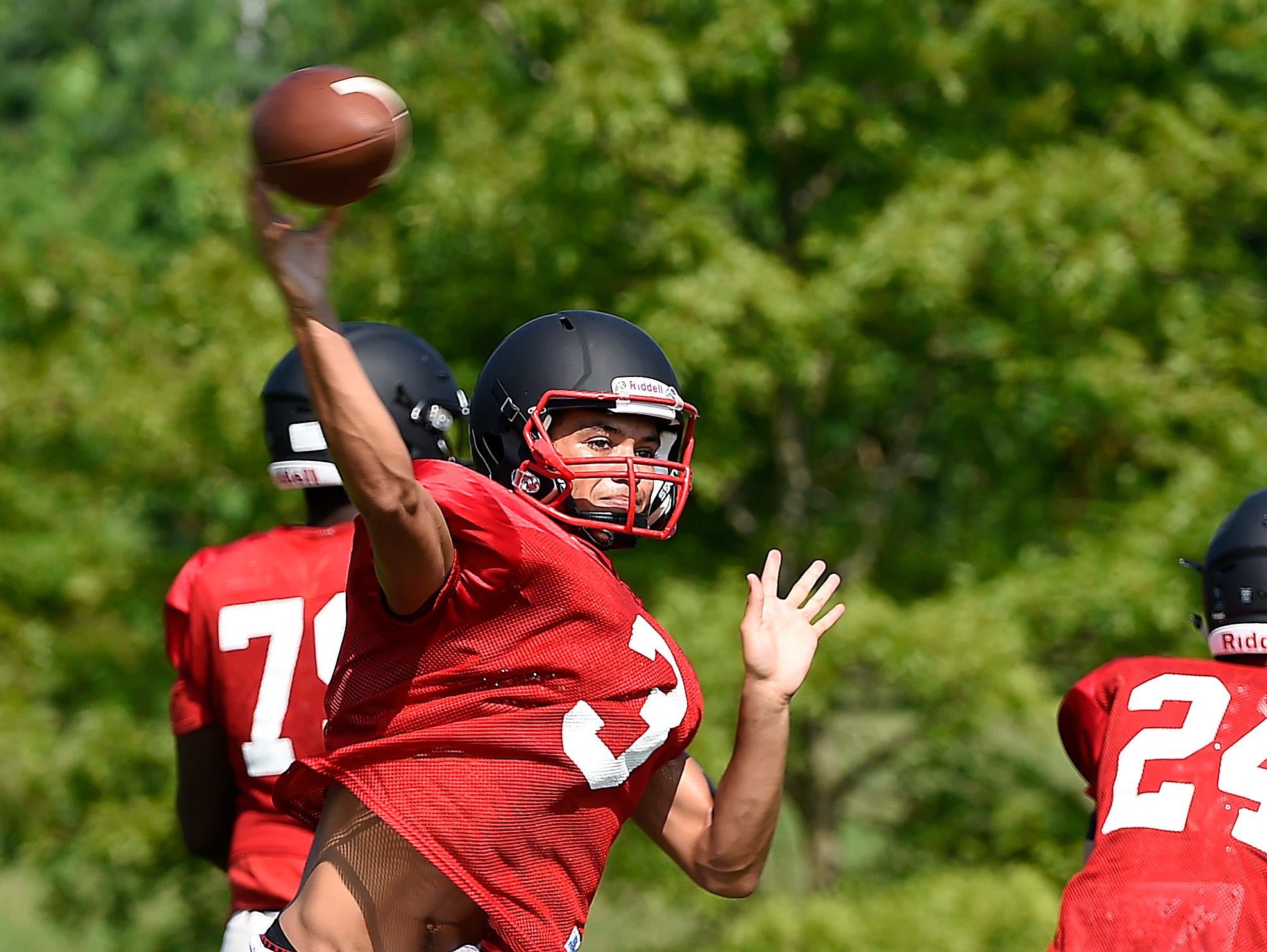 Ravenwood's Blake VanLandingham throws during practice Monday, the first day Tennessee high school football teams were allowed to practice in full pads.
