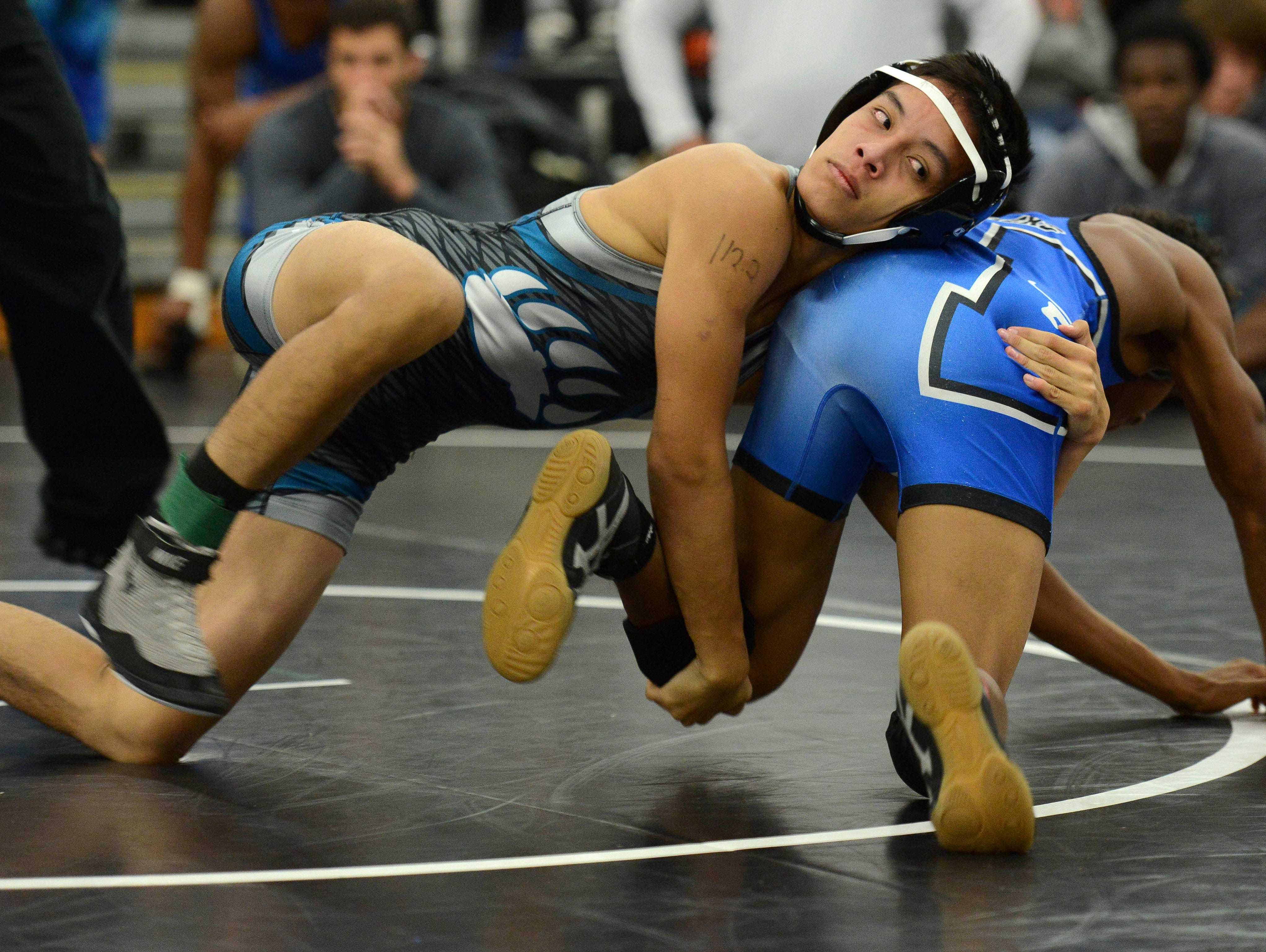 Bayside's Timothy Tran (left) wrestles Zacharie Kianes of Heritage on Day 1 of the Barbara Pill Memorial Wrestling Tournament.