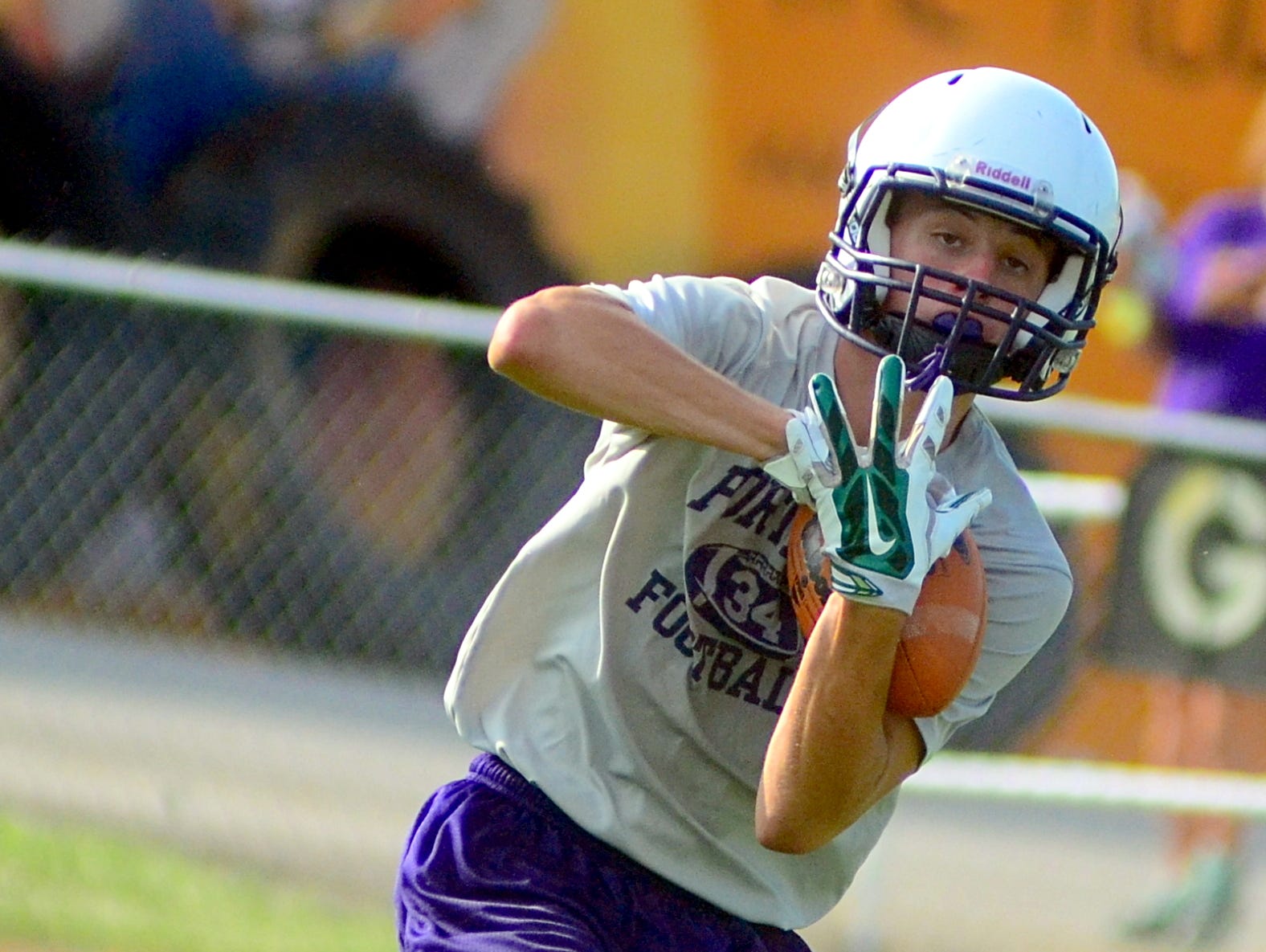 Portland High senior Logan Jernigan hauls in a pass during Trousdale County’s 7-on-7 workouts on Tuesday afternoon.