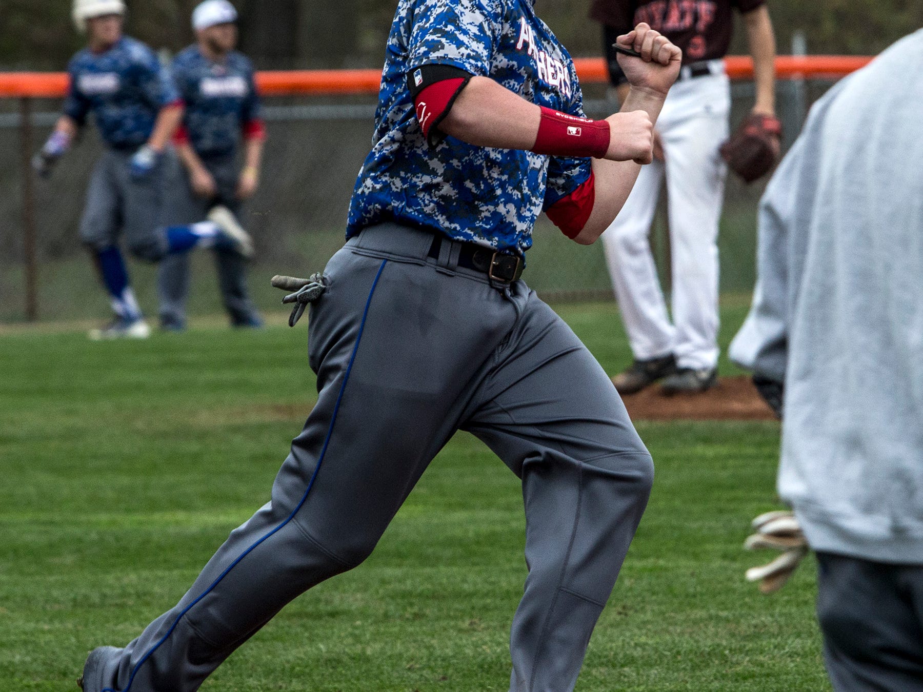 Jacob Dennis hits a three-run homer in Thursday’s game against Heath. The game was suspended in the fifth inning because of rain, with the score tied 4-4.