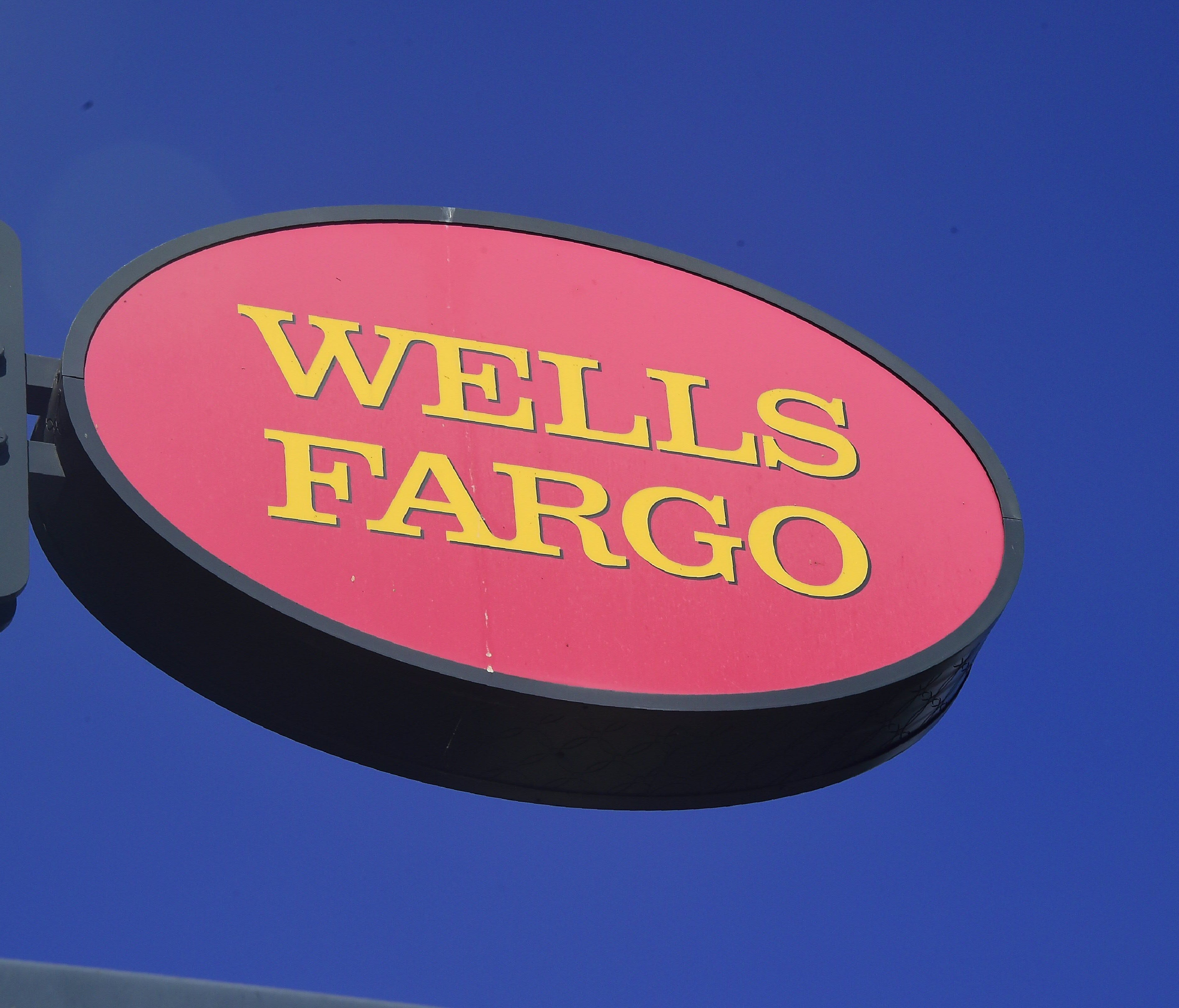 File photo taken in 2016 shows a Wells Fargo sign  in front of one of the bank's branches in Pasadena, California.