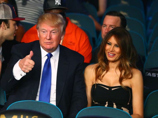 Donald Trump reacts alongside wife Melania Trump before