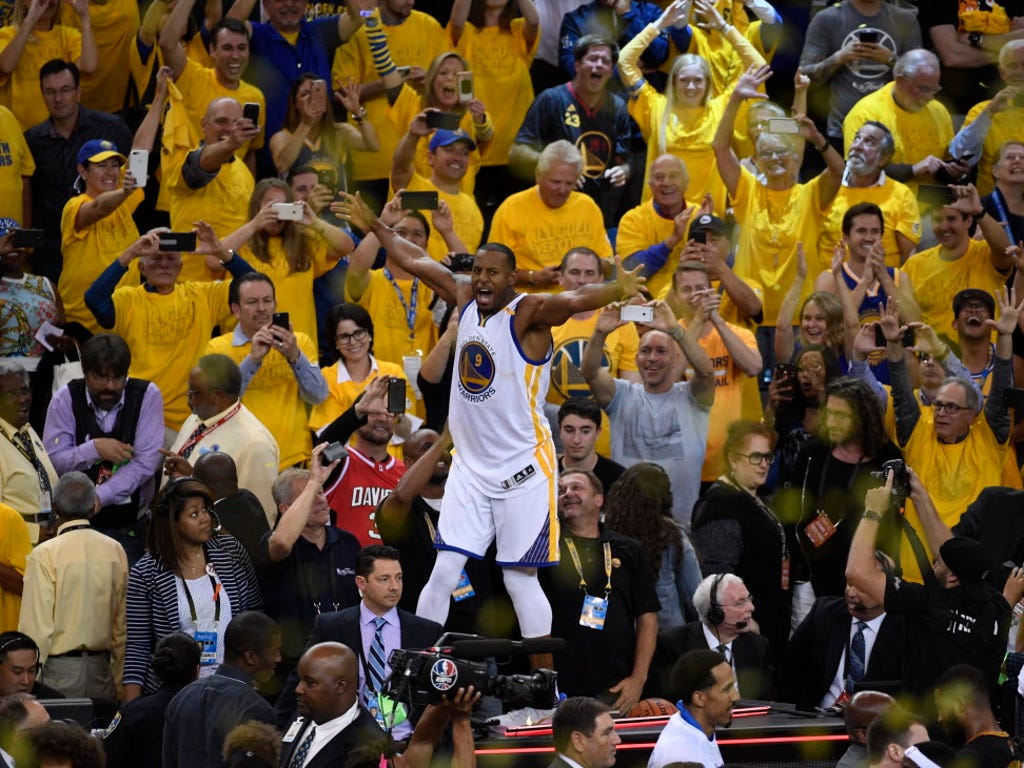 Golden State Warriors forward Andre Iguodala (9) celebrates with fans after defeating the Cleveland Cavaliers in Game 5 of the NBA Finals to win the championship.