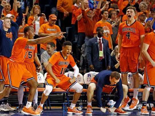 Players on the Bucknell bench celebrate after winning