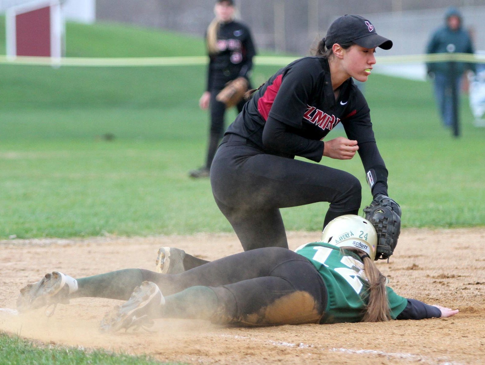Elmira’s Sarah Topping applies a tag against Vestal this past season. She was one of three Express players to earn STAC Metro/West all-conference honors.