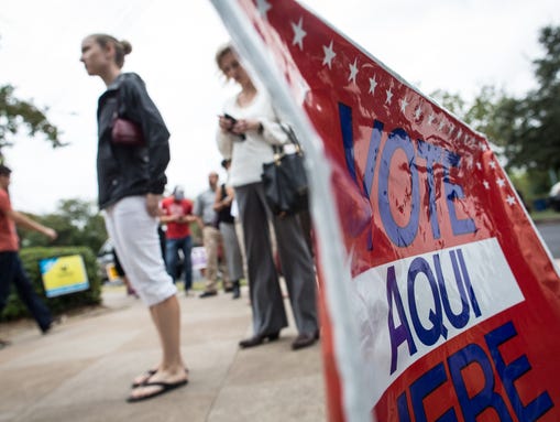 Voters in Texas wait in line to cast their ballots