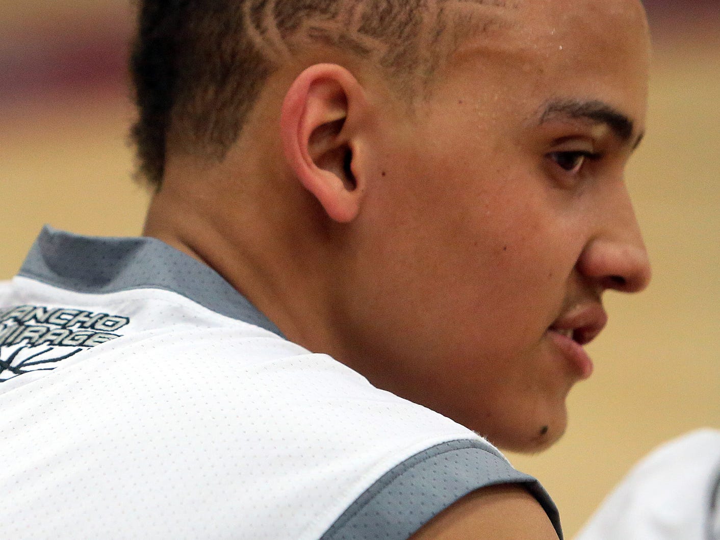 Rancho Mirage's Charles Neal has the letters CIF shaved into his haircut on Wednesday, February 18, 2015 as the Rattlers host the first boys basketball playoff game in school history. Neal finished the game, which was against Banning, as the Rattlers' leading scorer with 17 points. Their 81-56 victory means the school's second playoff game is imminent.