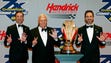 Rick Hendrick, left, poses with his driver Jimmie Johnson,