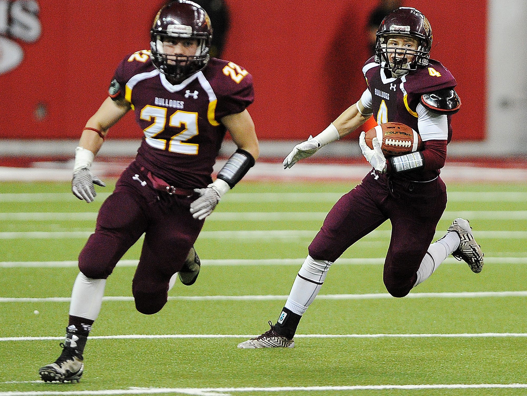 Madison's Mason Leighton (4) carries the ball during the first half of the 2014 South Dakota state Class 11A Championship game against Dell Rapids on Thursday, Nov. 13, 2014, at the DakotaDome in Vermillion, S.D.