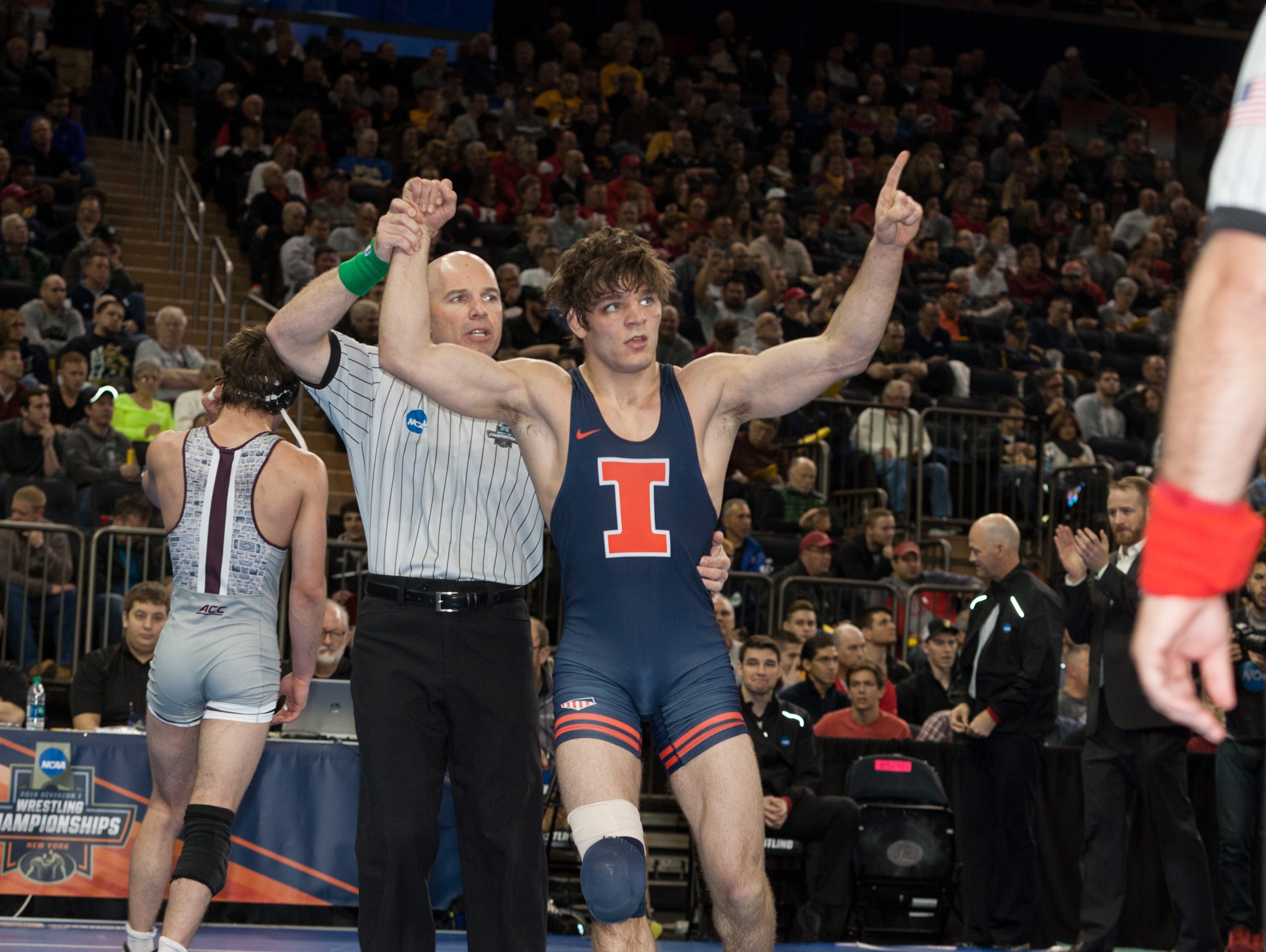 Illinois senior Steven Rodrigues reacts after winning the fifth place match at 165 pounds against Virginia Tech's David McFadden with an 8-5 decision at the NCAA Division I Wrestling Championships at Madison Square Garden on Saturday.