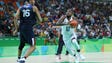 United States guard Kyrie Irving drives to the basket