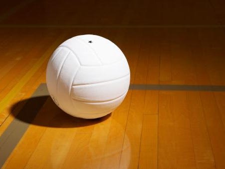 Volleyball on indoor volleyball court, elevated view
