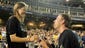 Vanderbilt pitcher Brian Miller, right, proposes to Megan Bonds after winning the College World Series Championship at TD Ameritrade Park in Omaha, Neb., Wednesday, June 25, 2014.